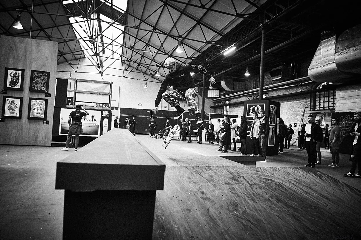 Skate ramp built inside a hall, in black and white